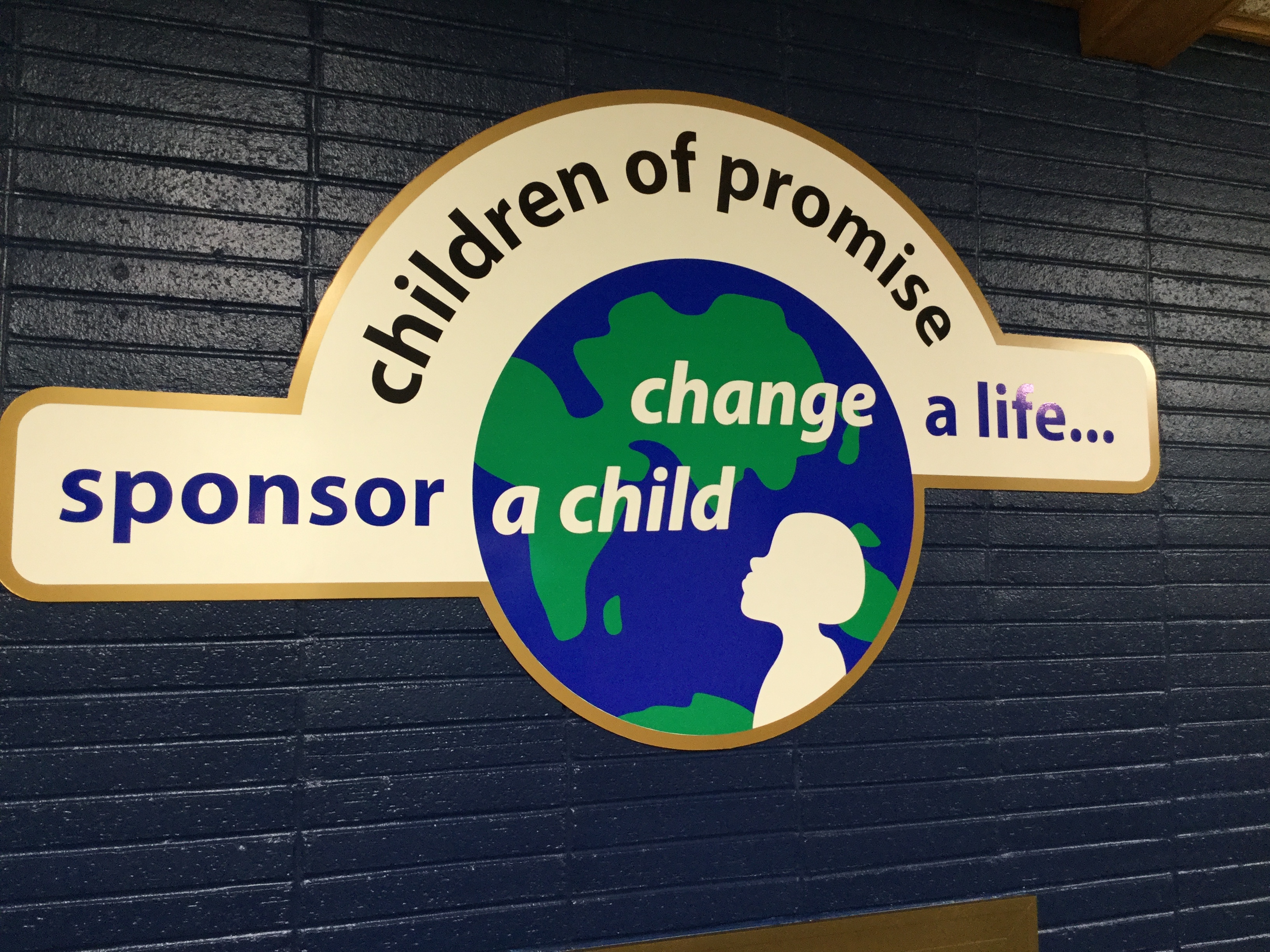 Our new sign is hanging over the fireplace!